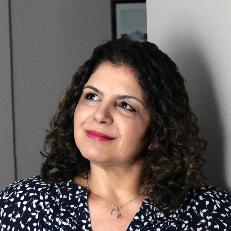 Headshot of Susan comtemplating the future